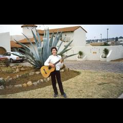 With guitar outside Aston Street