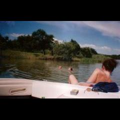 Craig & Adrian in the water. Debbie on the boat.