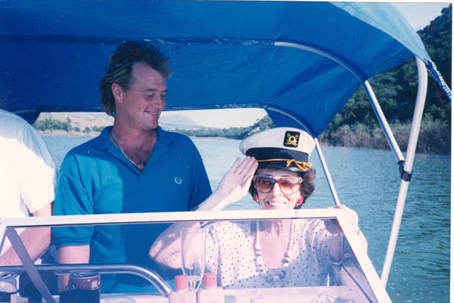 Granny Freda with Adrian steering boat on Dam